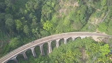 公路铁路高架桥森林山脉航拍视频的预览图
